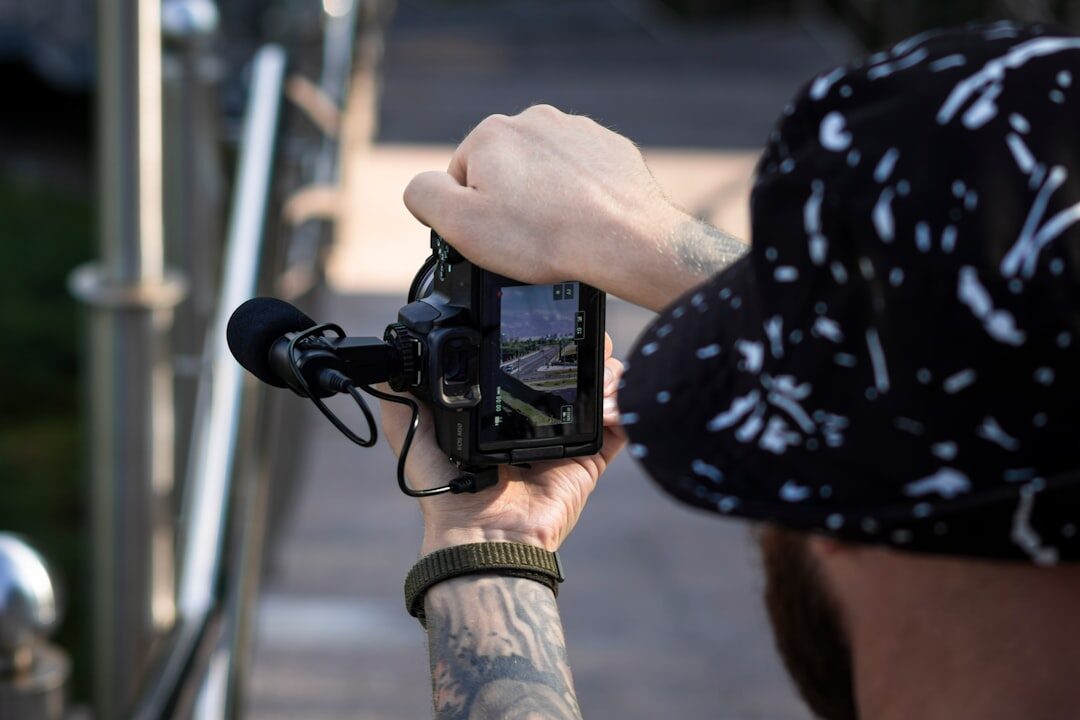 Mobile journalist filming a street interview with a smartphone rig