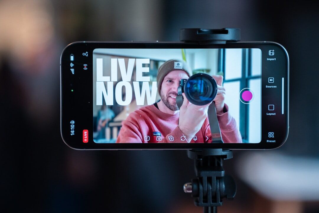 Journalist filming a live video broadcast with a tripod and phone